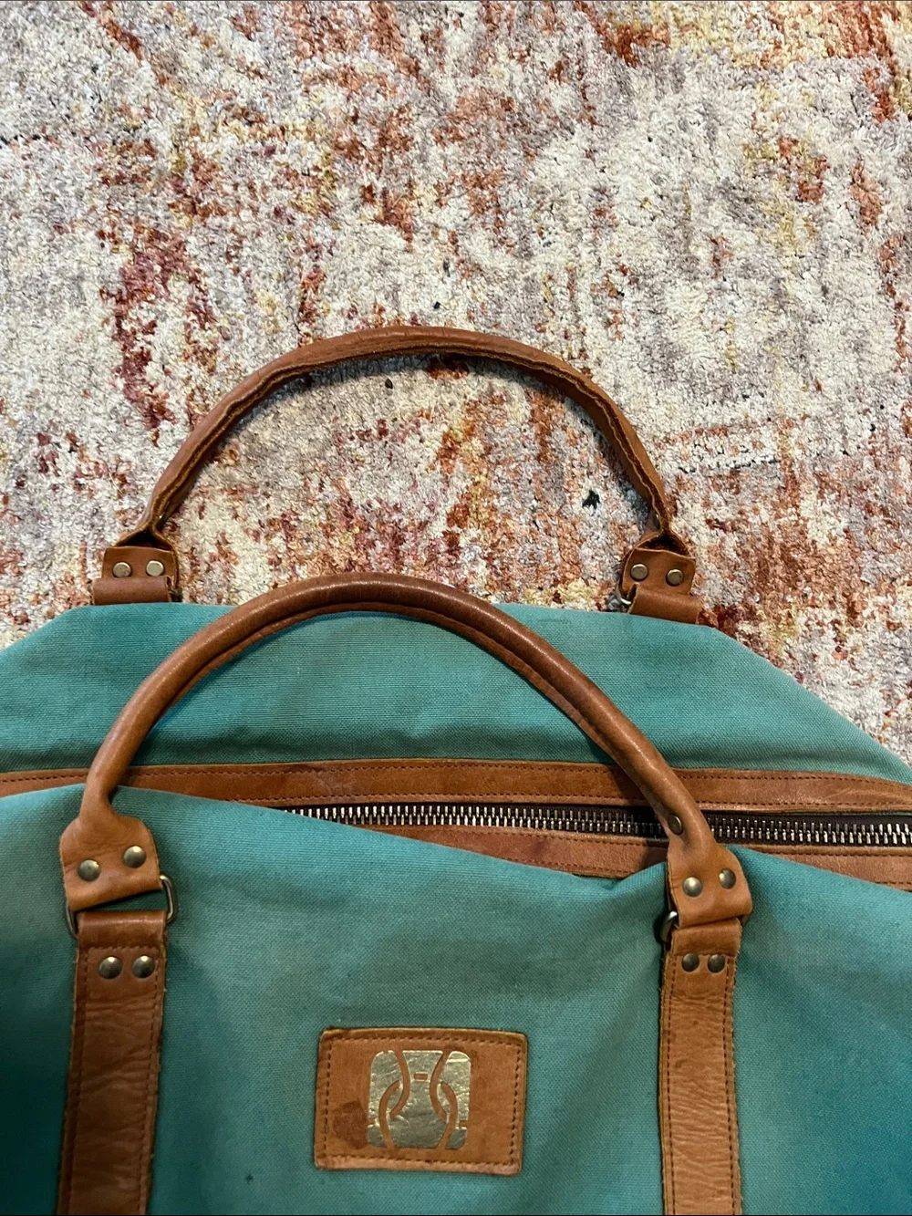 Vintage green duffle bag with leather handles